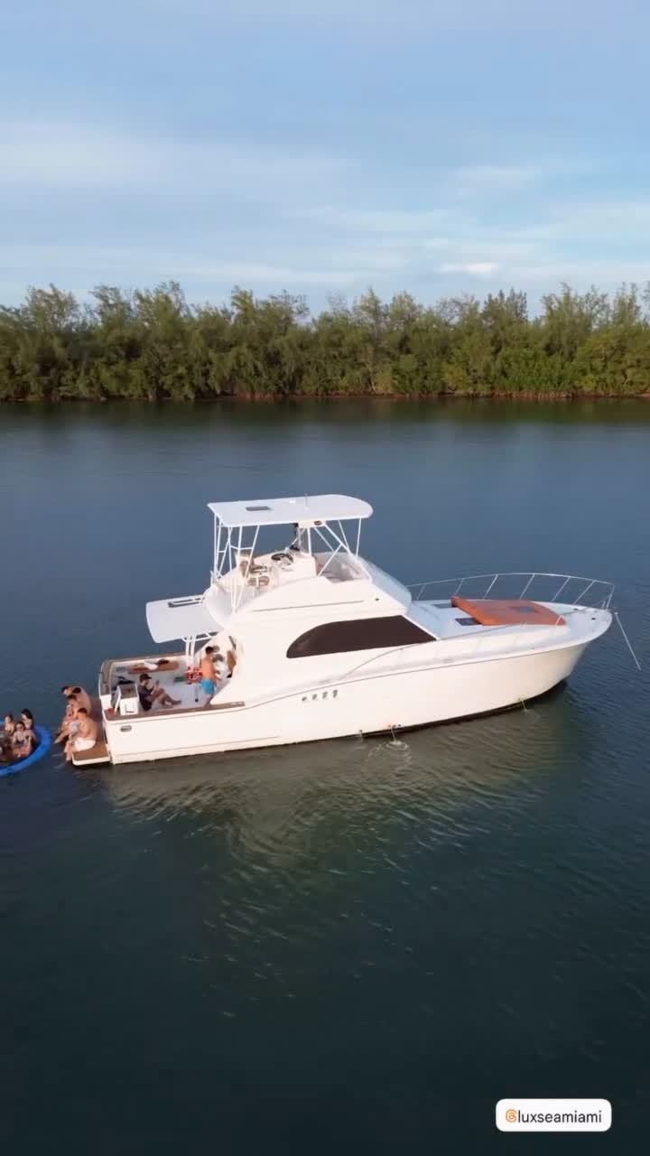 The Chris Craft anchored close to the mangroves with the family aboard