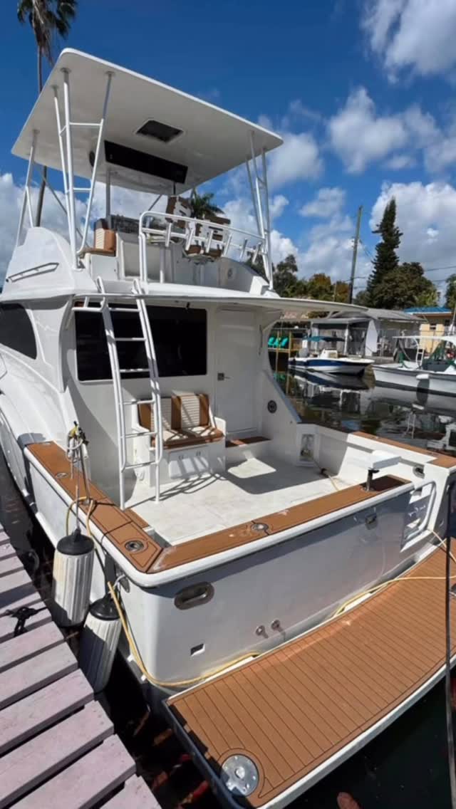 The Chris Craft alongside the dock with the cockpit table set up